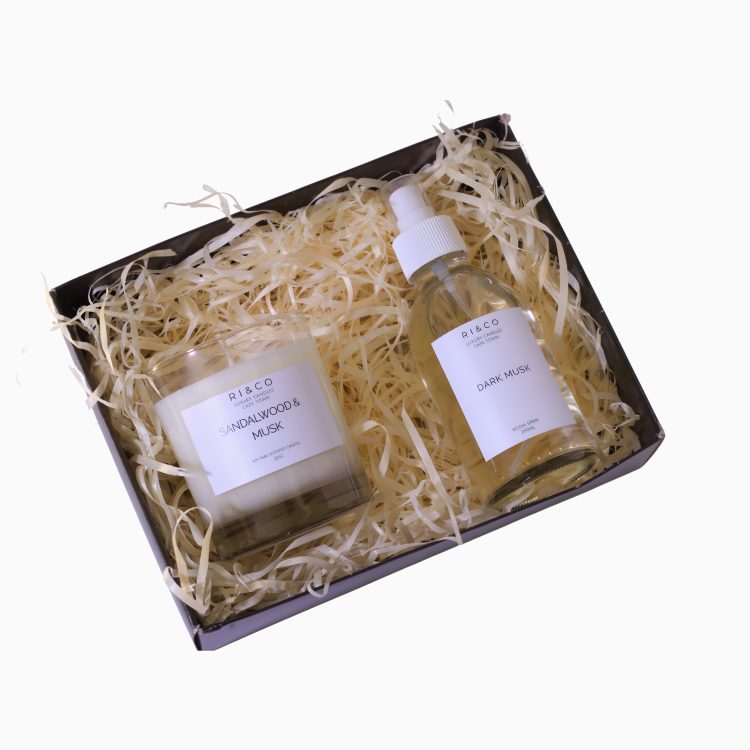 sandalwood and musk candle and dark musk room spray gift set in luxury packaging with shredded filler, elegant home fragrance duo