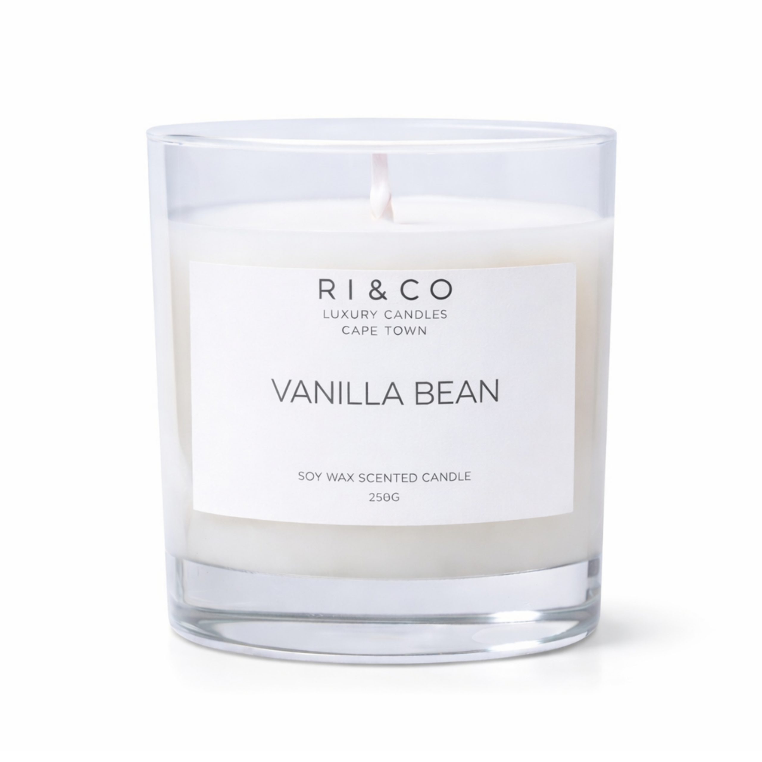 RI & CO Vanilla Bean luxury soy wax candle in clear glass jar on white background