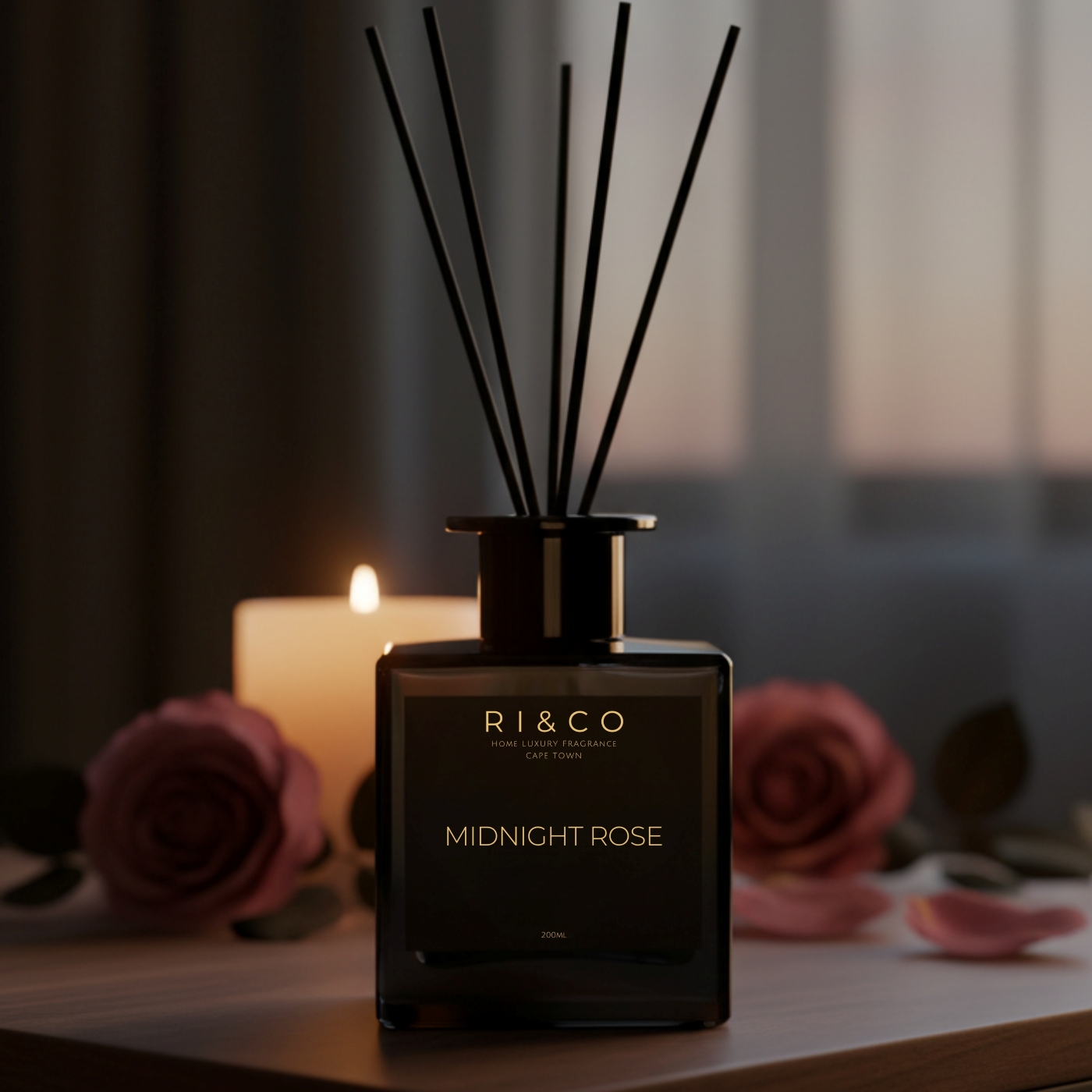 Midnight Rose reed diffuser in a soft, moody bedroom setting