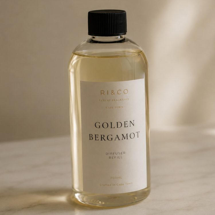 Luxury Golden Bergamot reed diffuser refill by RI&CO with minimalist luxury packaging and soft editorial lighting.