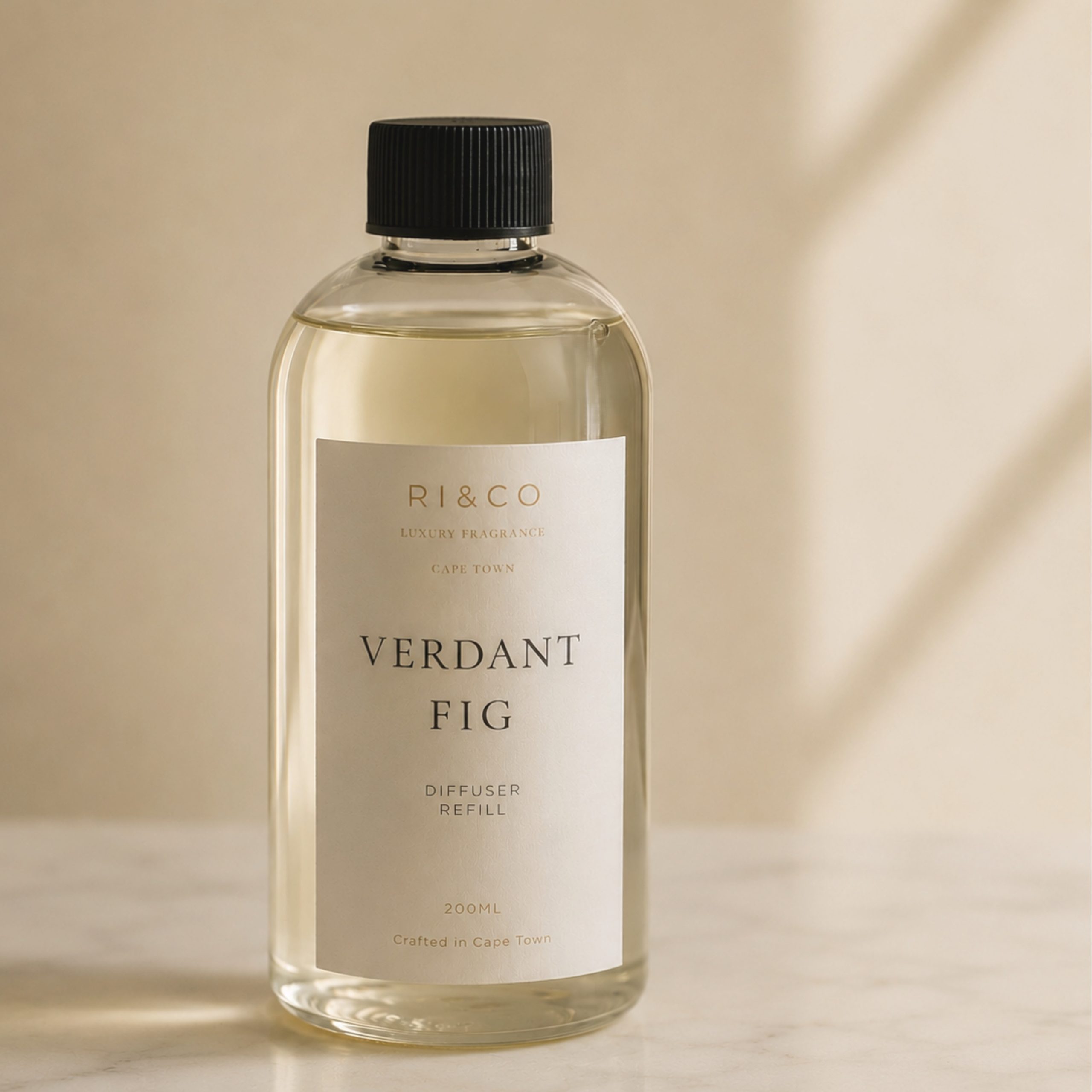 Luxury Verdant Fig reed diffuser refill by RI&CO styled with warm ivory tones and boutique hotel inspired aesthetics.